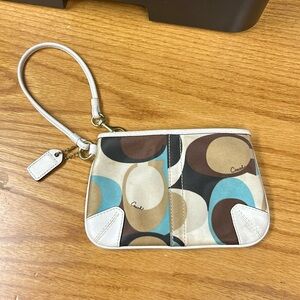 Coach Brand wristlet minor spotting shown in picture